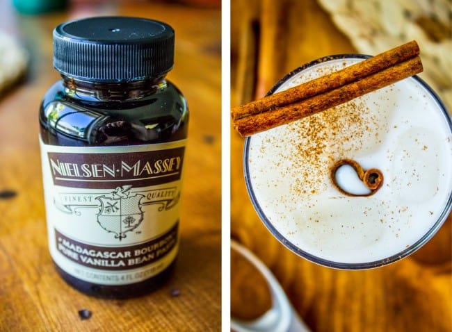 a jar of vanilla bean paste and a glass of horchata with a cinnamon stick in it.