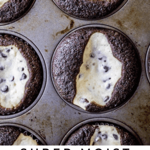 A muffin tin filled with chocolate cupcakes, each topped with cheesecake batter and chocolate chips. Text at the bottom reads, Super Moist Black Bottom Cupcakes - The Food Charlatan, featuring rich chocolate flavor.