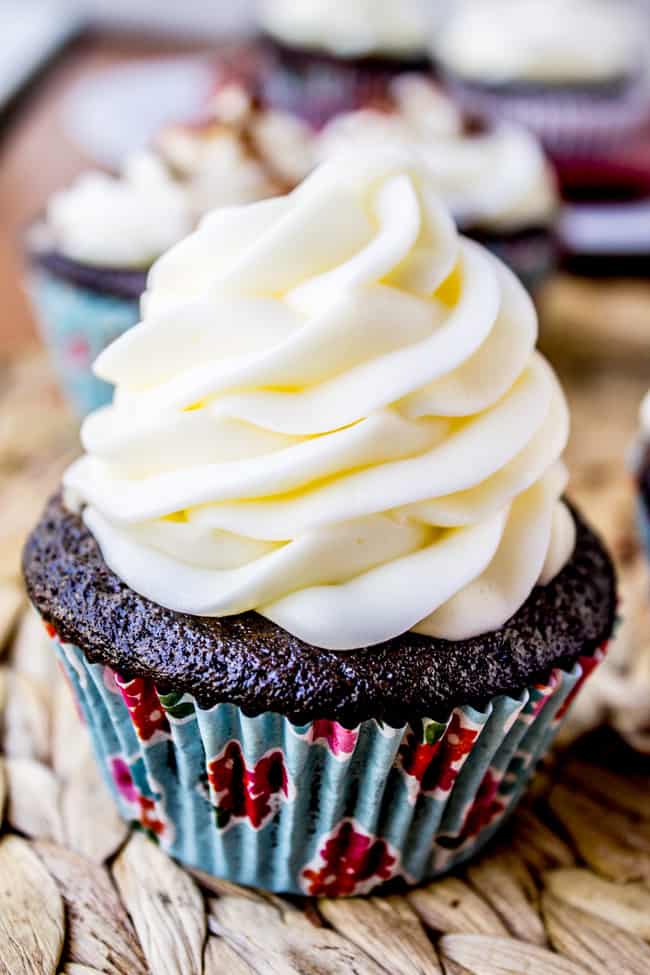 a cream-cheese filled chocolate cupcake with a generous swirl of cream cheese frosting on top.