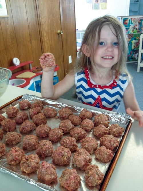 Charlotte making meatballs - she's cute, but meatballs?