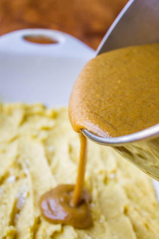 Pouring pumpkin pie dump cake