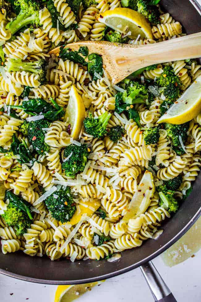 overhead of Broccoli Pasta Recipe in a skillet topped with lemon.