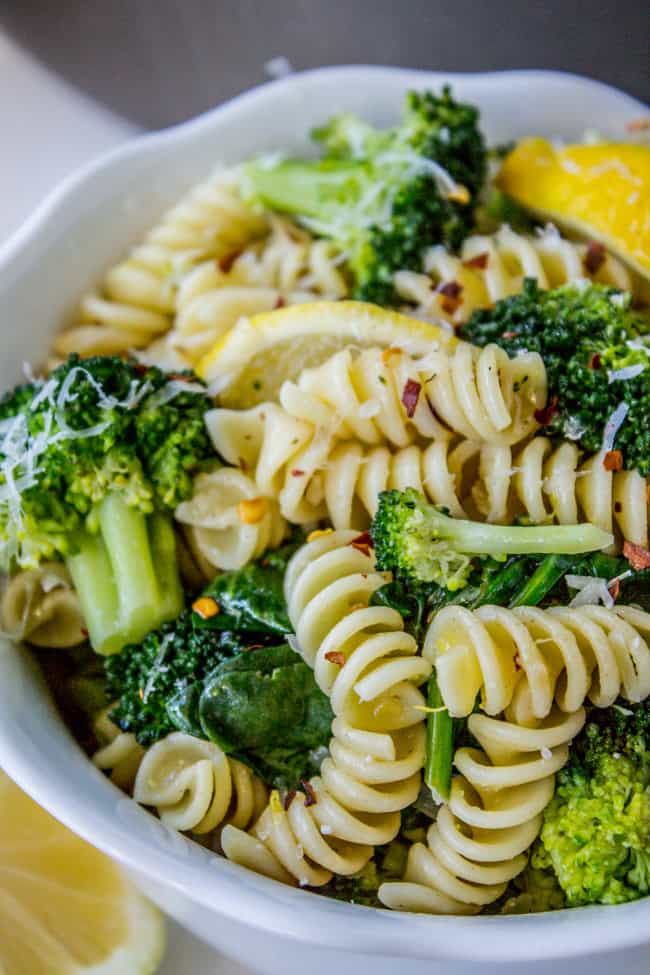 closeup of Pasta with Broccoli garnished with lemon in a bowl