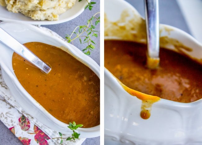 homemade turkey gravy in a white gravy boat with a metal ladle.