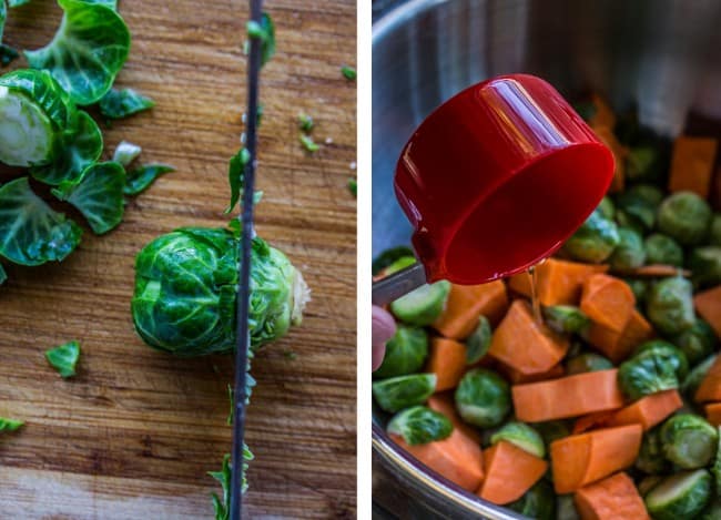 A knife slicing into a brussel sprout next to a measuring cup pouring oil onto chopped brussel sprouts and sweet potatoes