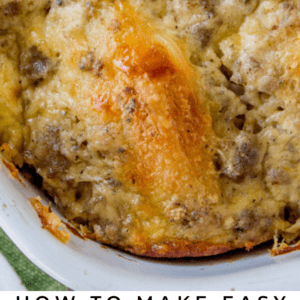 overnight biscuit and sausage gravy casserole in a white dish.