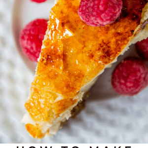 a slice of creme brulee cheesecake with fresh raspberries.