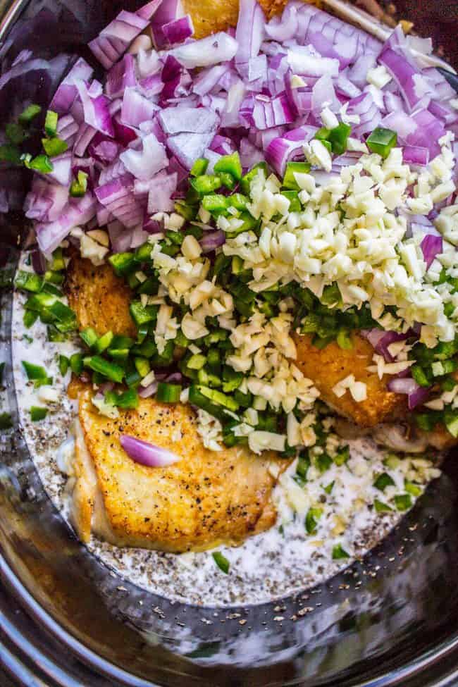 slow cooker basil chicken in coconut curry in the crockpot ready to cook. 