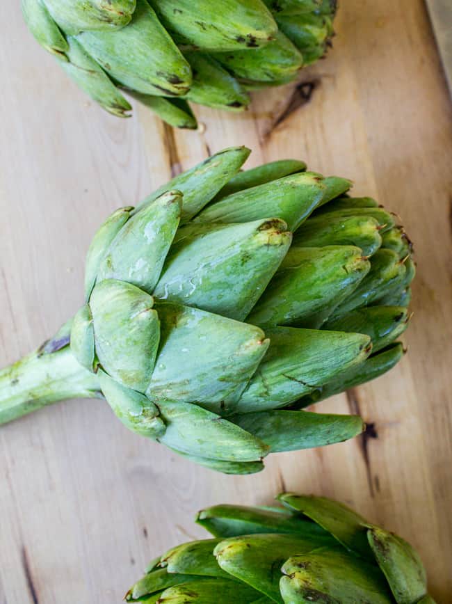 Garlic Roasted Artichokes with Pesto Dipping Sauce from The Food Charlatan