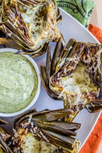 Garlic Roasted Artichokes with Pesto Dipping Sauce from The Food Charlatan