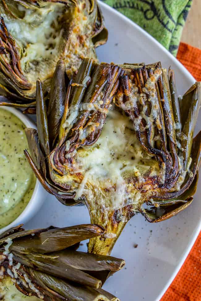 Garlic Roasted Artichokes with Pesto Dipping Sauce from The Food Charlatan