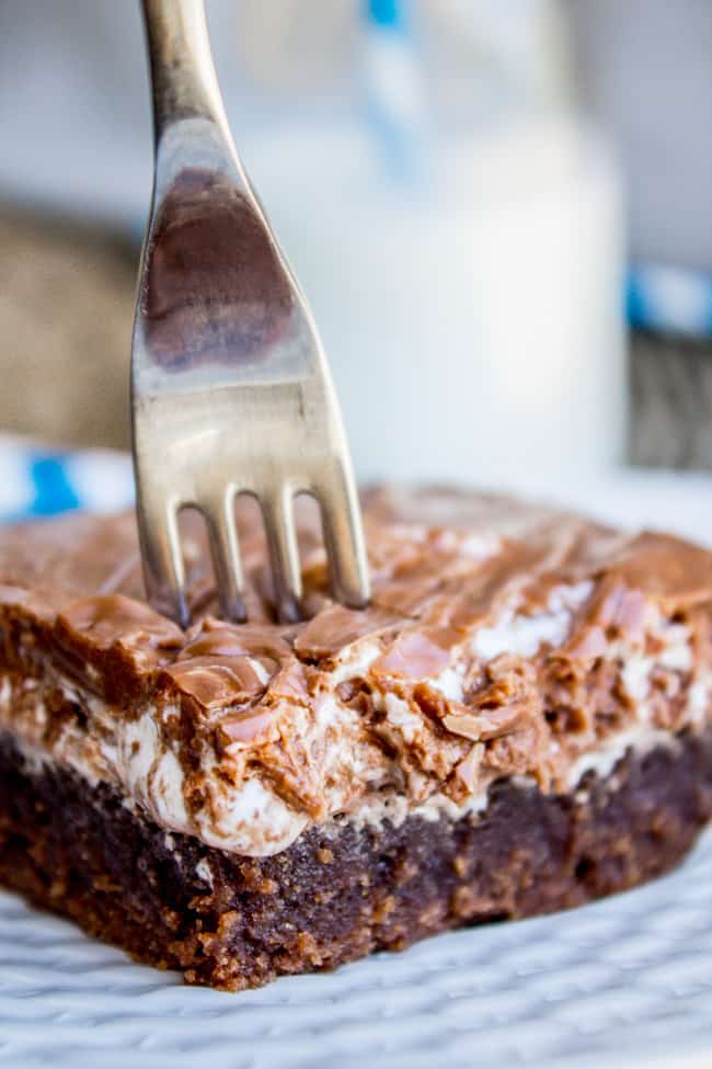 Mississippi mud cake on a plate with a fork stuck in it. 