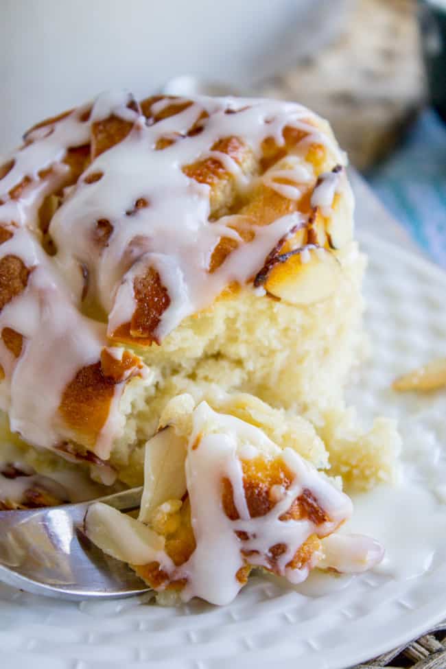 a single honey almond crunch roll with sweet almond glaze drizzled on top. 