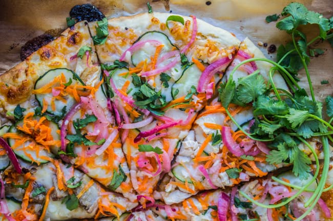 Cooked thai pizza on parchment paper