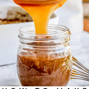 Caramel sauce flows from a spoon into a glass jar, with text below reading My Favorite Caramel Sauce - The Food Charlatan.