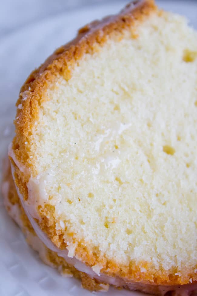 a slice of cream cheese pound cake with vanilla glaze.