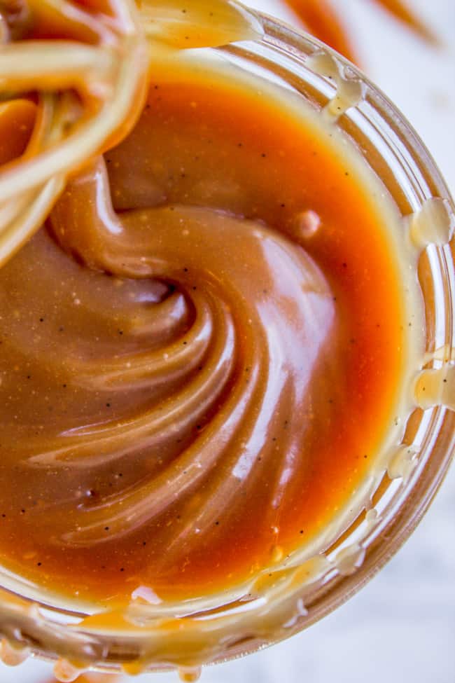 caramel sauce shot from up close in a mason jar.