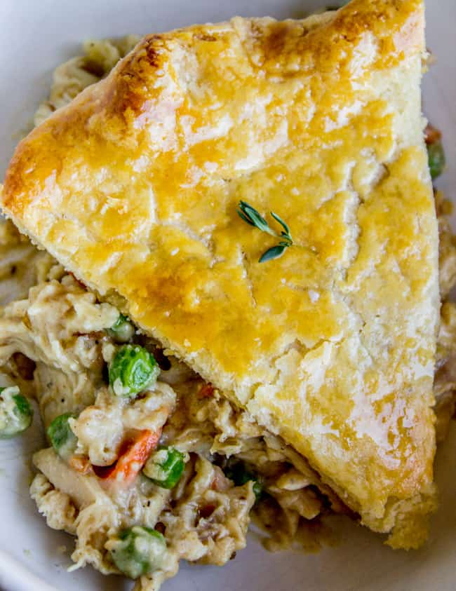 a piece of chicken pot pie with a flaky golden crust. 