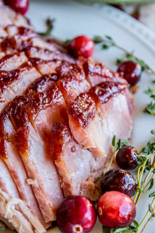 ham glaze recipe brown sugar, sliced with cranberries and thyme