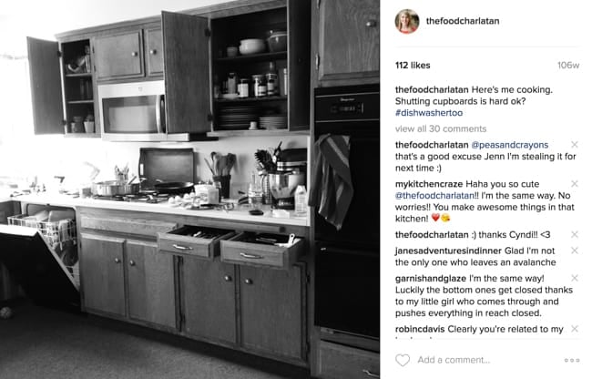 Kitchen photo with cabinet doors open.