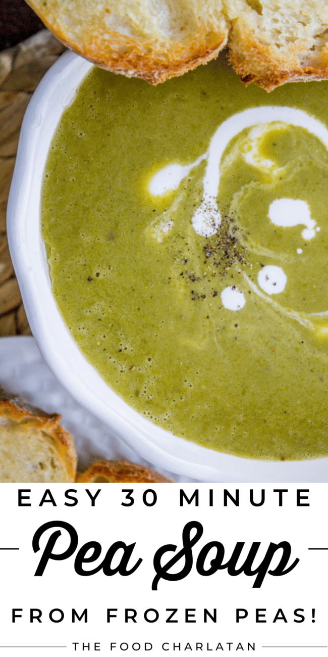 a bowl of pea soup with cream and fresh pepper on top.