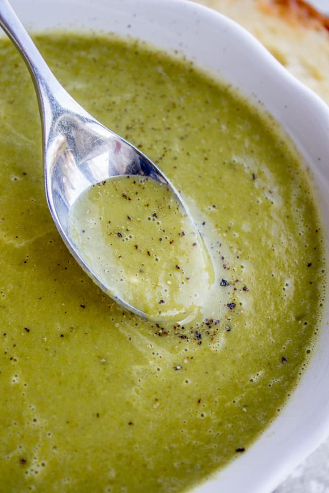 a spoon dipping into homemade pea soup.