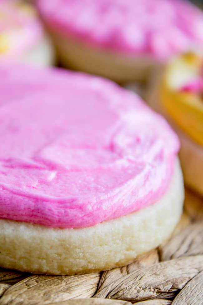 Pink cookie frosting on top of sugar cookie