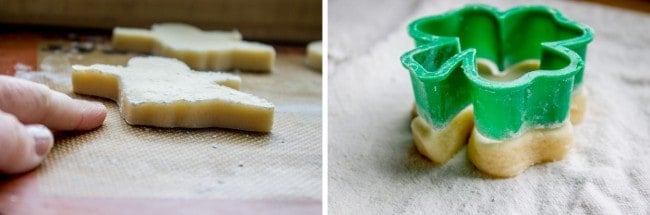 best soft sugar cookie dough in shape of Christmas tree on pan next to a plastic cut out trimming shamrock-shaped dough 