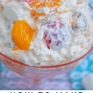 mandarin orange ambrosia salad in a pink glass dish.