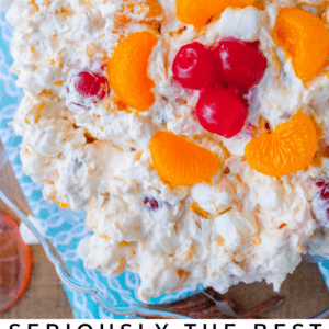 ambrosia salad with mandarin oranges in a glass serving bowl.