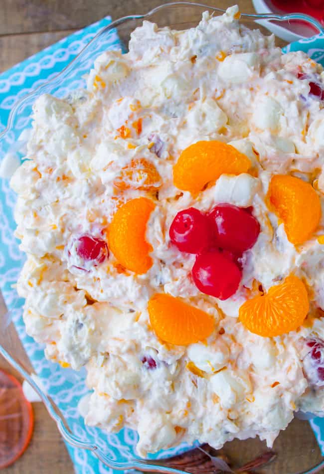 mandarin orange ambrosia salad in a glass serving bowl.