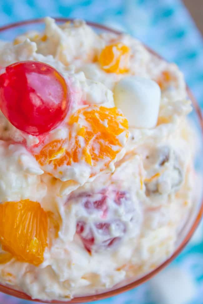 mandarin orange ambrosia salad in a pink glass dish.