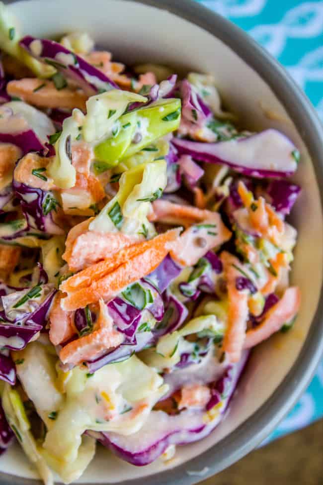 a bowl of coleslaw with herbs.