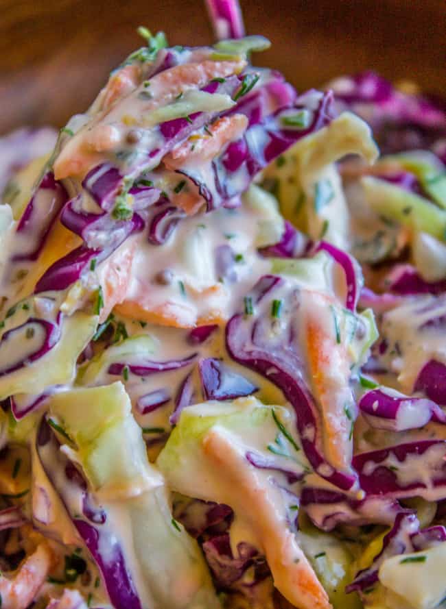 close up shot of coleslaw with fresh herbs.