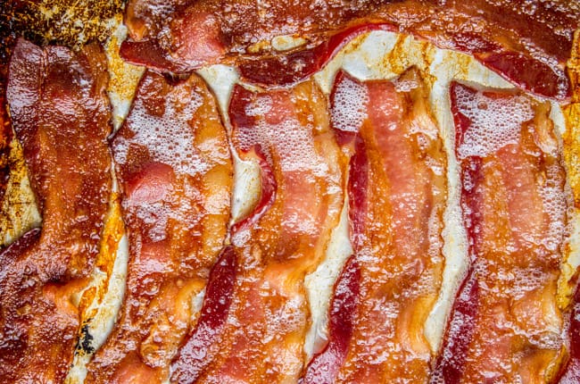 cooked bacon on a baking sheet.