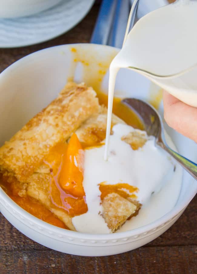 Pouring cream on apricot peach slab pie