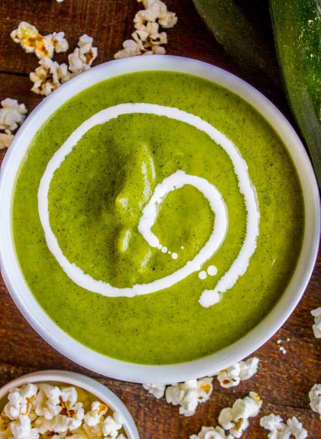 creamy zucchini soup with a drizzle of cream, popcorn.