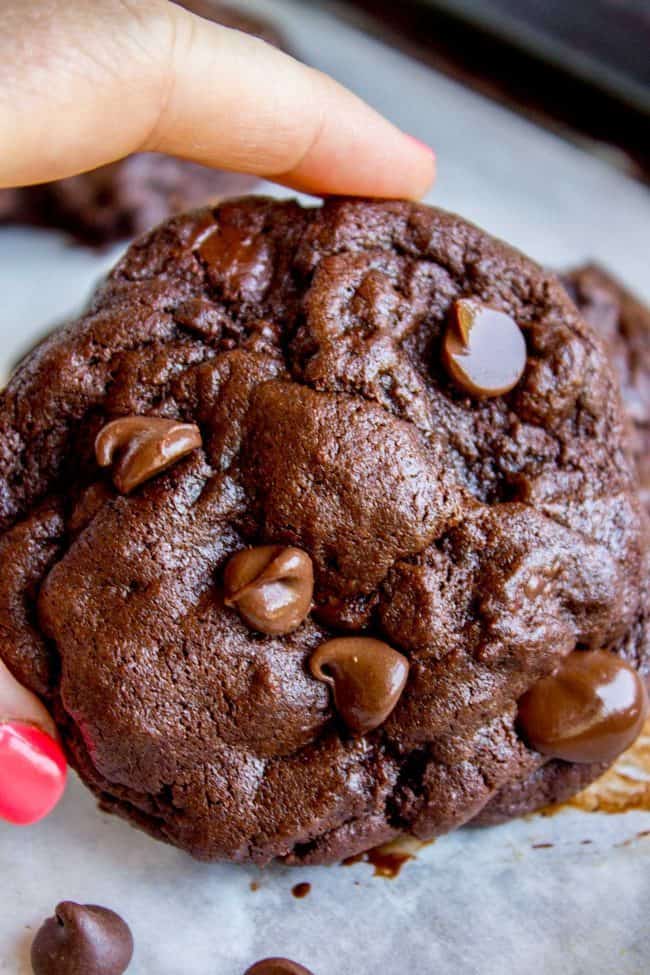 thick double chocolate chip cookie on parchment paper.