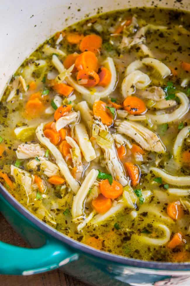 Chicken noodle soup with homemade noodles in a pot. 