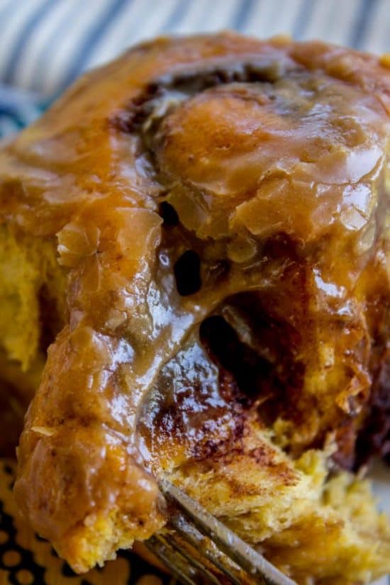 Pumpkin Cinnamon Rolls with Caramel Cream Cheese Frosting from The Food Charlatan