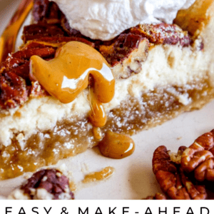 A slice of pecan pie cheesecake topped with whipped cream and pecans, drizzled with caramel sauce. The text reads: Make-Ahead Cheesecake Pecan Pie - The Food Charlatan.