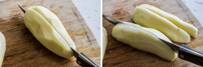 cutting peeled potatoes on a wooden cutting board.