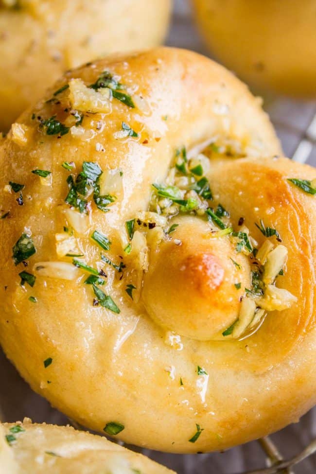 garlic knots with fresh parsley garlic butter.