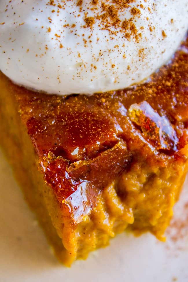 a slice of Crème Brulée Pumpkin Pie with a forkful removed from the tip. 