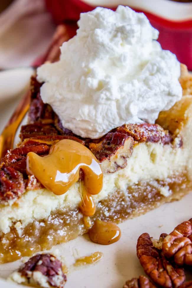 pecan pie cheesecake with homemade caramel sauce and whipped cream.