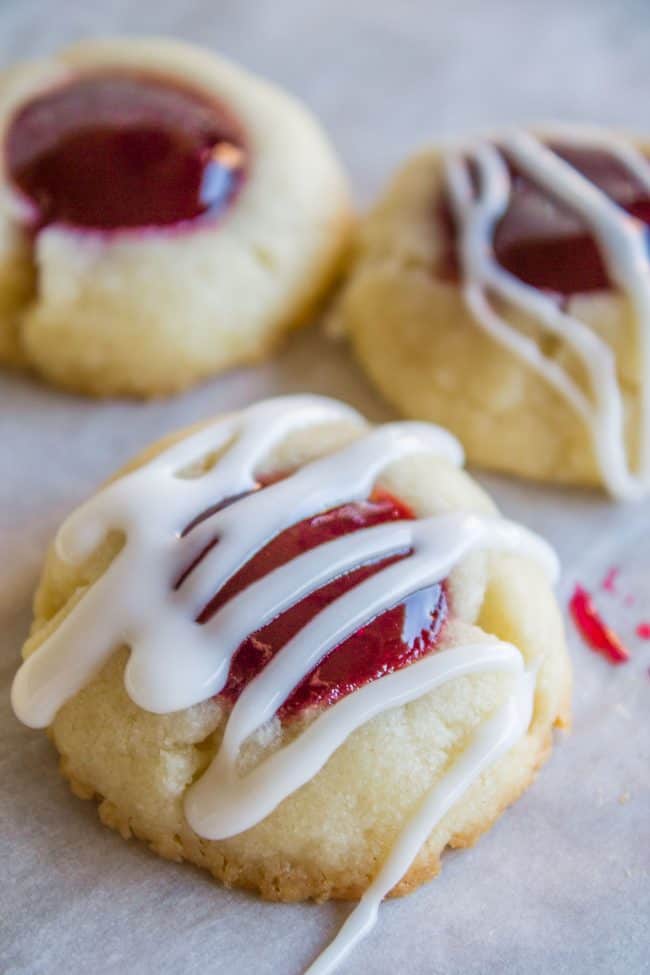 Raspberry Shortbread Cookies with glaze drizzled on top.