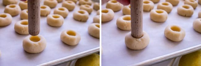 Using spatula end to make thumbprints in dough balls.