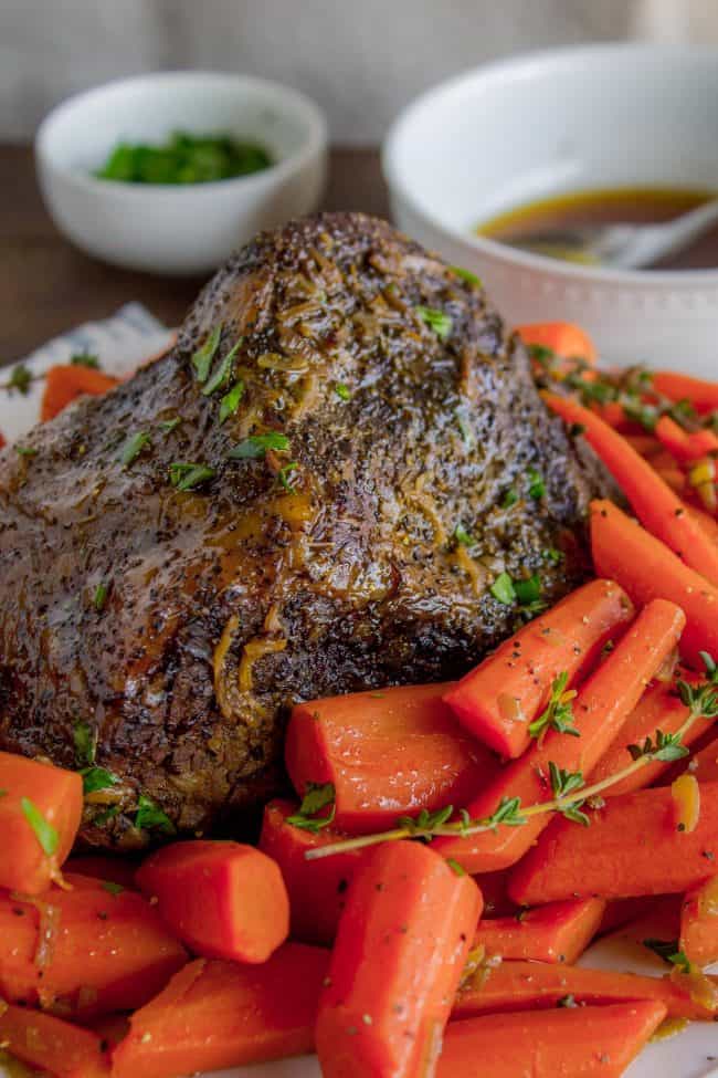 Easy Fall-Apart Pot Roast with Carrots (Slow Cooker) from The Food Charlatan. Super tender, juicy, fall-apart crock pot roast is not as hard as you think! This slow cooker recipe uses a few simple ingredients (one of them is patience) to make the most flavorful pot roast ever! #potroast #slowcooker #crockpot #roast #chuckroast #tender #juicy Pot roast with carrots