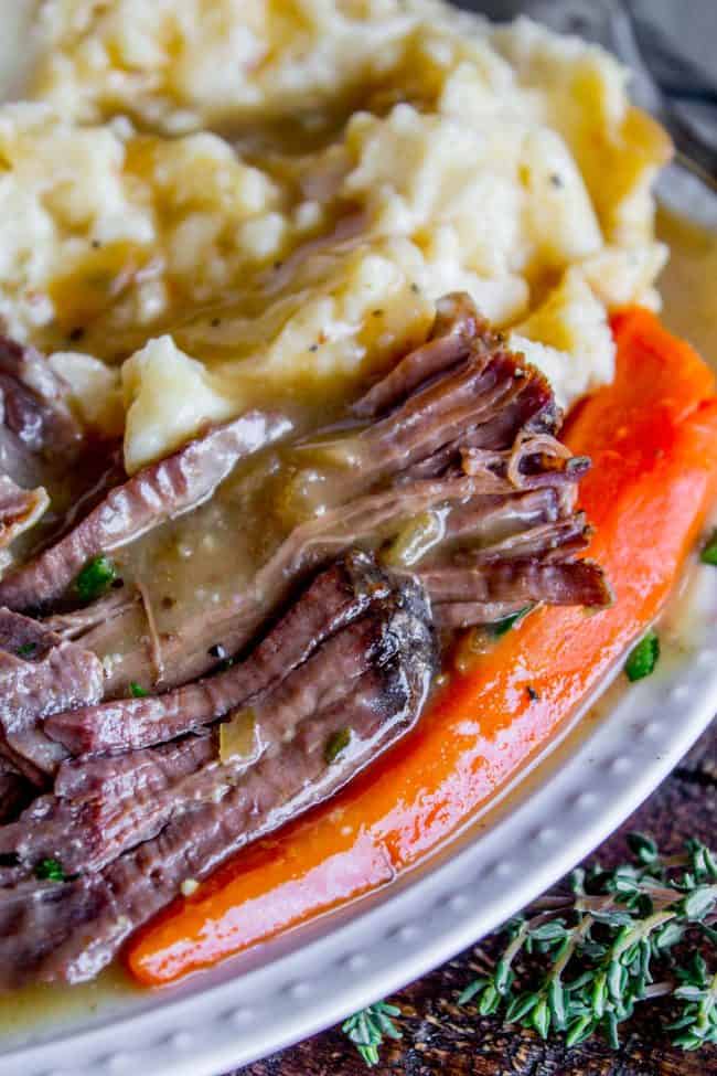 Easy Fall-Apart Pot Roast with Carrots (Slow Cooker) from The Food Charlatan. Super tender, juicy, fall-apart crock pot roast is not as hard as you think! This slow cooker recipe uses a few simple ingredients (one of them is patience) to make the most flavorful pot roast ever! #potroast #slowcooker #crockpot #roast #chuckroast #tender #juicy Pot roast crock pot