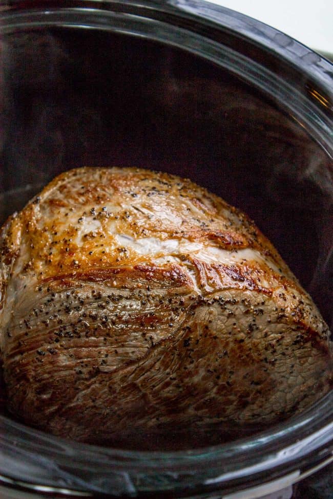 Easy Fall-Apart Pot Roast with Carrots (Slow Cooker) from The Food Charlatan. Super tender, juicy, fall-apart crock pot roast is not as hard as you think! This slow cooker recipe uses a few simple ingredients (one of them is patience) to make the most flavorful pot roast ever! #potroast #slowcooker #crockpot #roast #chuckroast #tender #juicy Seared chuck roast in crock pot